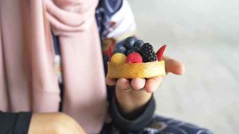 women eating berry fruit tart