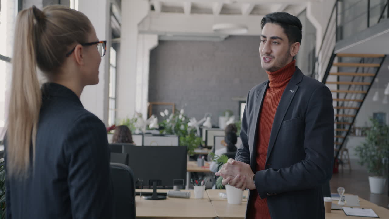 Businesspeople in conversation in a modern office