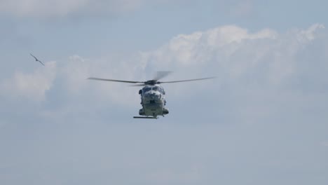 search and rescue sar helicopter flying front view - sky background