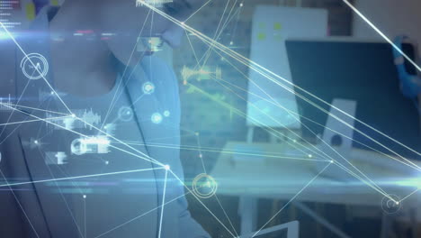 woman reviewing technology data at desk, with floating network lines and interactive charts