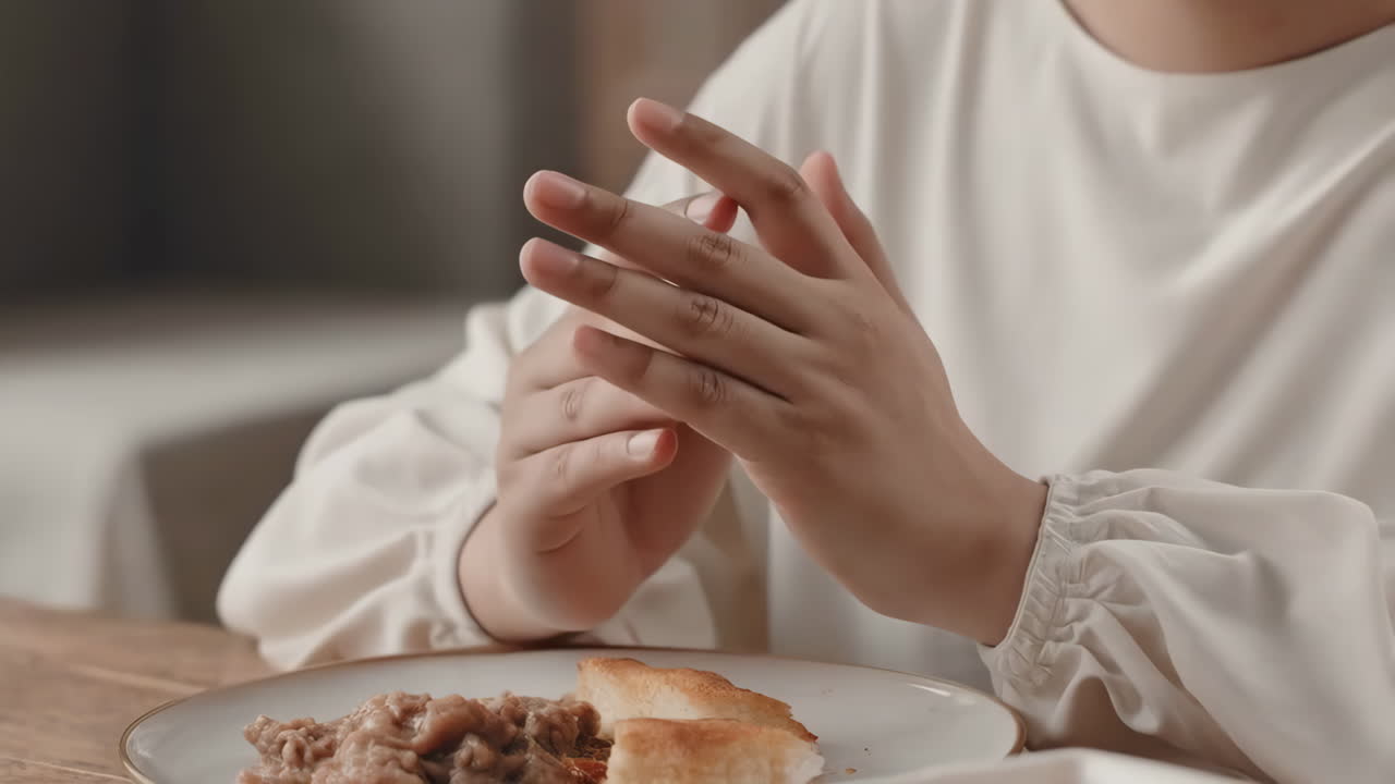 Person praying before meal