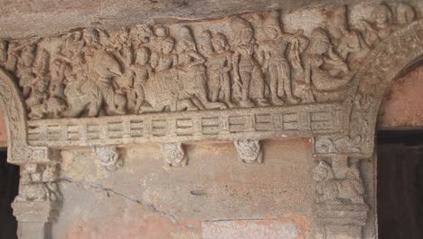 Slow-pan-of-hand-carved-temple-wall-in-Sri-Lanka