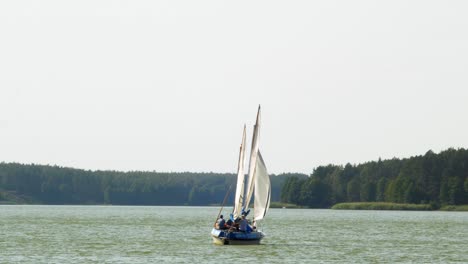 two-masted  yacht sailing in wdzydze lake in kaszubski park krajobrazowy in pomeranian voivodeship