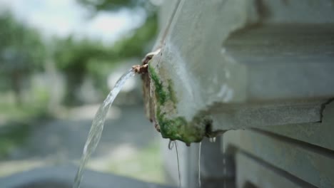 a close-up shot of a thermal mineral spring water source located in the st. petka memorial shrine, in the town of rupite, petrich, bulgaria.