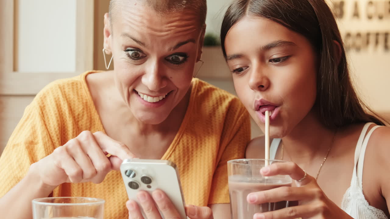 Mother and Daughter Enjoy Breakfast at Cafe