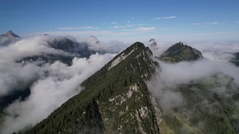 aerial view of mystical mountains: capturing the beauty of green peaks and clouds