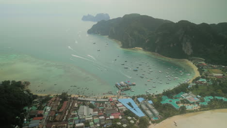 aerial view of phi phi islands bay with boats and coastal town