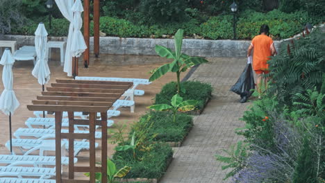 worker is cleaning near swimming pool