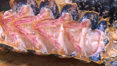 close up of a cooked lobster tail section