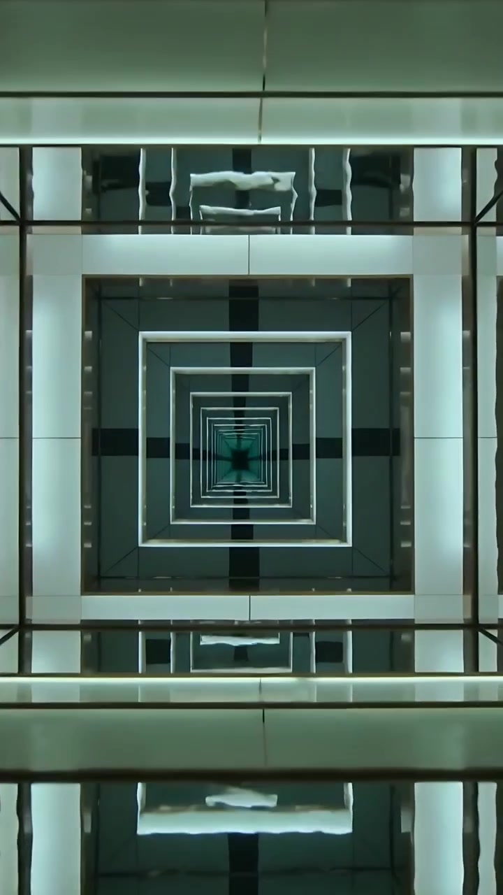 Vertical video: Starting camera gliding through atrium, centering nested LED squares and beams