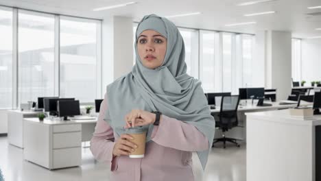 tensed muslim businesswoman waiting for someone