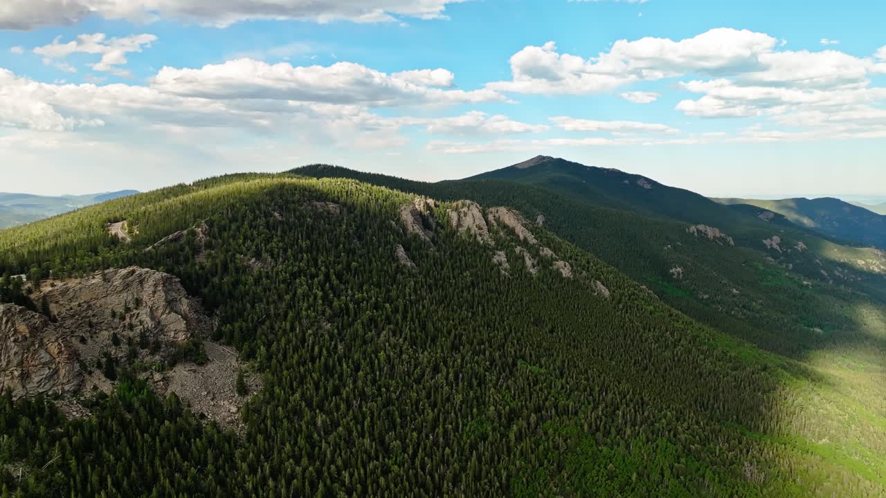 Cloud shadow recedes up along continental divide as seen from Mount Blue Sky Colorado