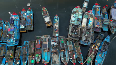 vietnamese fishing trawlers tied together in danang harbour drone track left