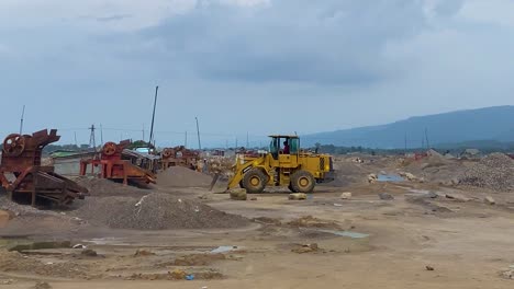 driving by the stone crushing site in bholaganj, sylhet, capturing the hustle and bustle of the asian industry