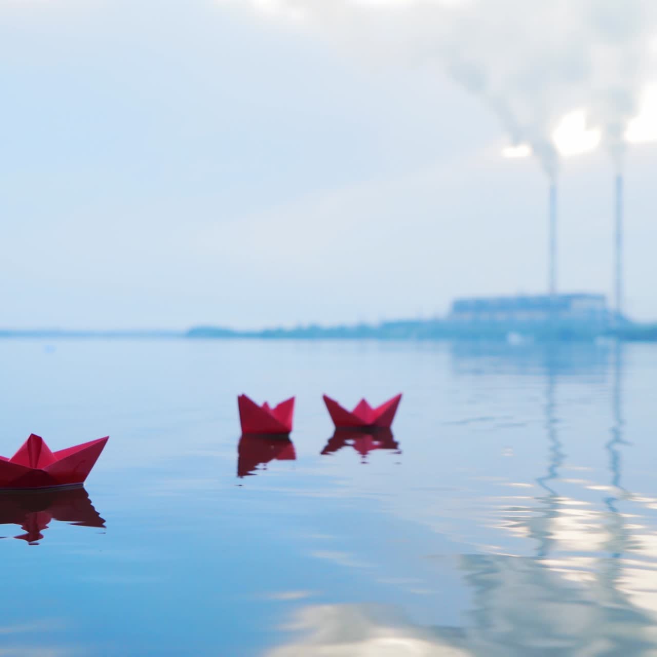 Paper boats floating on a river. Origami.