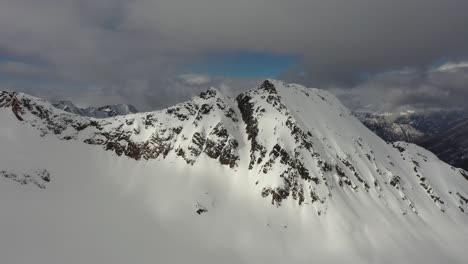 Party-of-skiers-climbing-a-couloir-in-the-mountains-of-British-Columbia---Canada