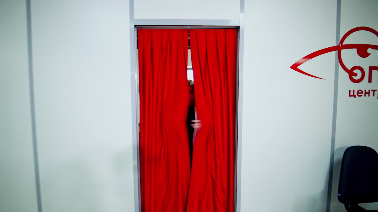 Woman in fitting room. Happy woman in dressing room store in the shopping center