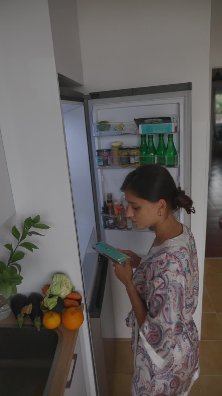 Woman Checking Fridge Inventory