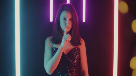 woman in a sequined dress with neon lights