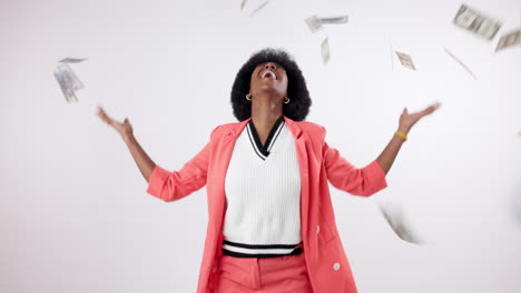 a woman celebrates success with money falling around her
