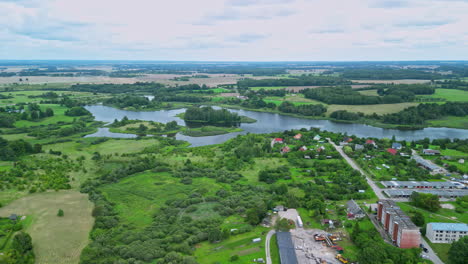 Aerial-capture-of-the-forested-landscape-with-flowing-branches-of-river-and-water-bodies