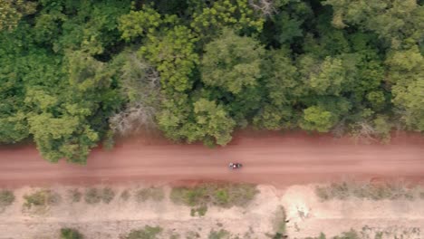 drone shot of a road next to the jungle in cambodia