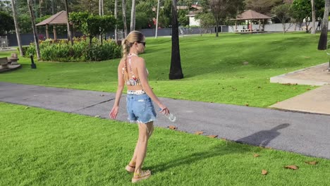 woman walking in a tropical park