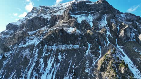 drone video of a tall mountain covered in snow