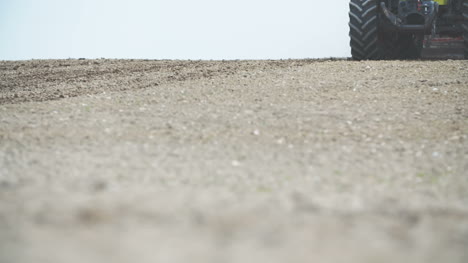 Agriculture-Detail-Shoot-Of-Agricultural-Tractor-Sowing-And-Cultivating-Dry-Field-