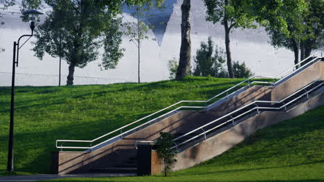 long stairs park hill view autumn day. modern stone stairs with handrails.