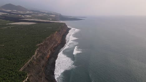 banana plantation fields and solidified lava in sea after volcano eruption at la palma, canary islands