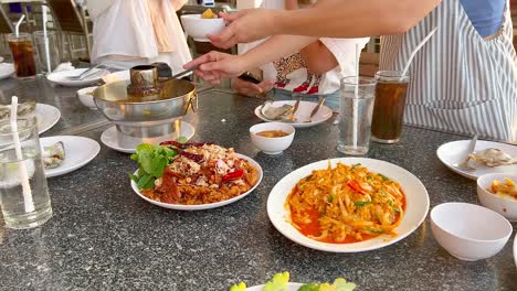 people enjoying seafood dishes in chonburi, thailand