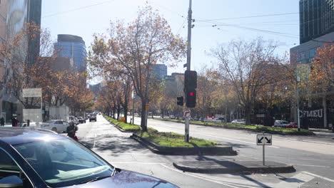 pedestrians and vehicles at a busy intersection