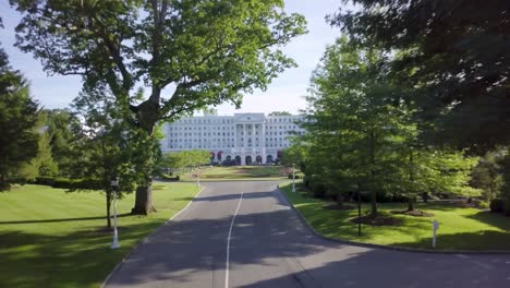 Greenbrier-Resort-drone-main-entrance-slow-push-West-Virginia-sunny-summer-afternoon