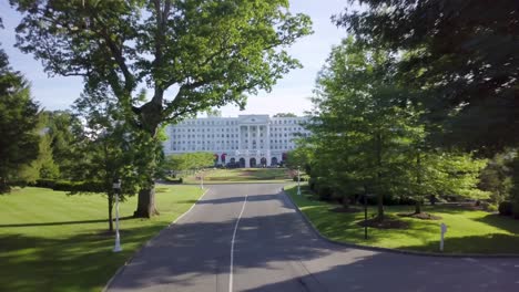 greenbrier resort drone main entrance slow push west virginia sunny summer afternoon