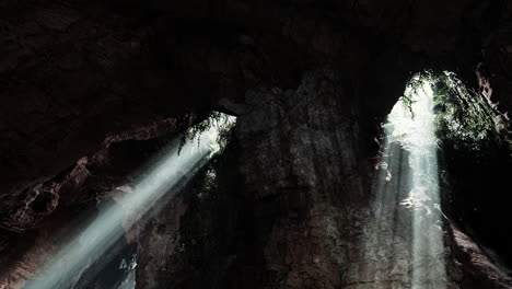 sunbeams illuminating the dark depths of a cave