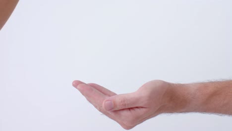 Hands-of-diverse-people-giving-blood-drop-on-white-background,-slow-motion