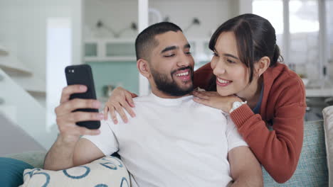 A-young-couple-using-a-phone-browsing-online