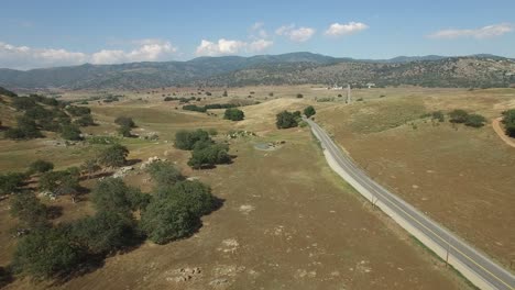 Aerial-over-an-empty-road-in-the-countryside