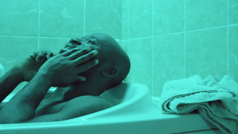 African-American-Man-Talking-on-Phone-in-Bath