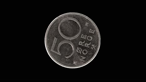 norway 1987 fifty øre coin reverse with denomination rotating on black background