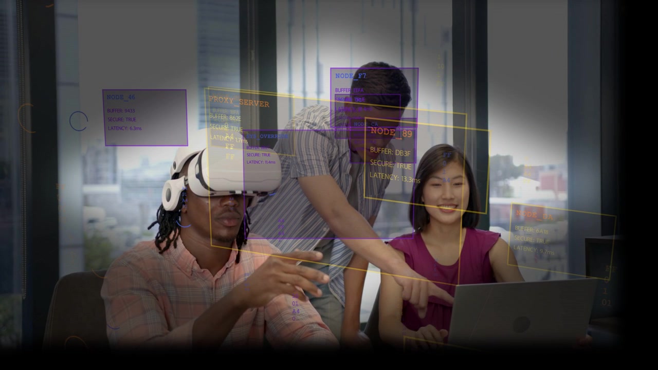 Vertical video: Team testing VR demo in office, VR user gesturing while peer guiding via laptop HUD