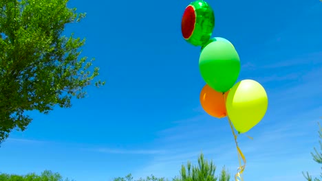 colorful balloons on blue sky background