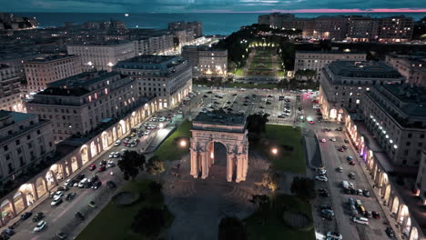 aerial night view of arco di riccardo in trieste, italy