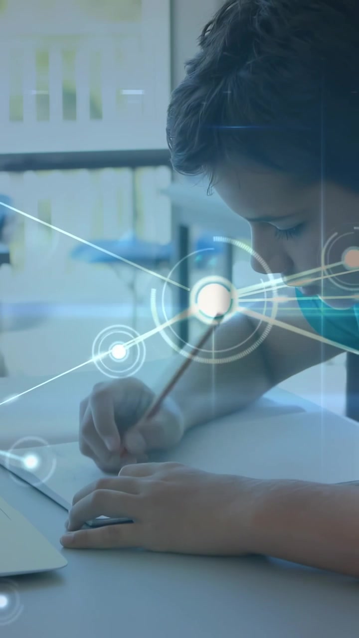 Vertical video: Student touching pencil to paper sparking animated node network over hands to study