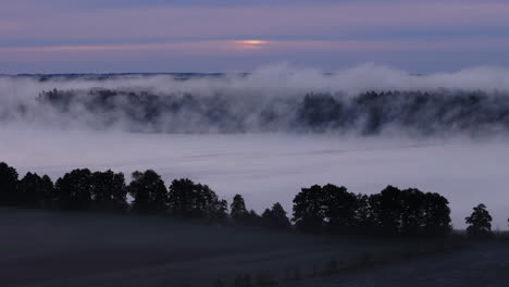 misty sunrise over a valley