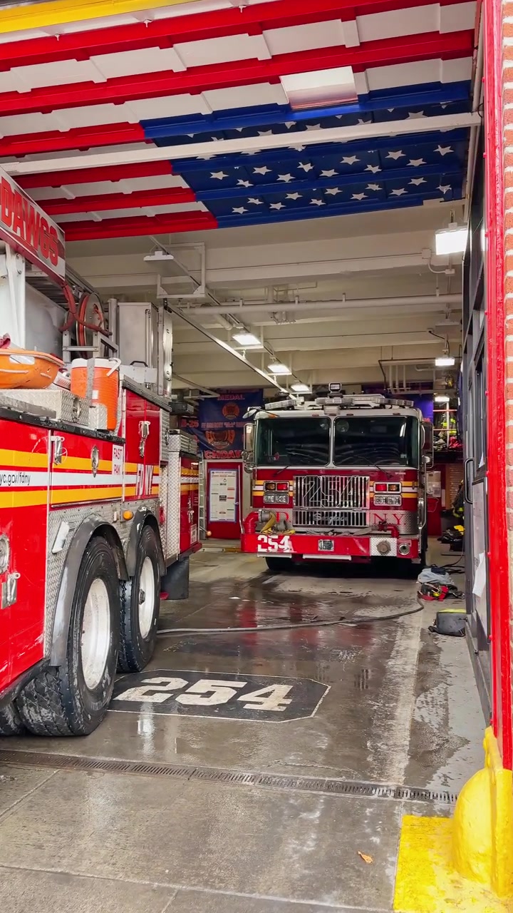 New York, USA, 25 January 2026: Close up of red fire truck rear section at station. Detailed view of the rear of a red fire truck with a ladder, stretcher, and firefighting equipment.