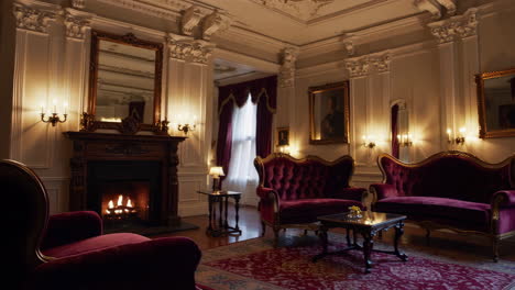 luxurious red velvet living room with ornate decor and fireplace
