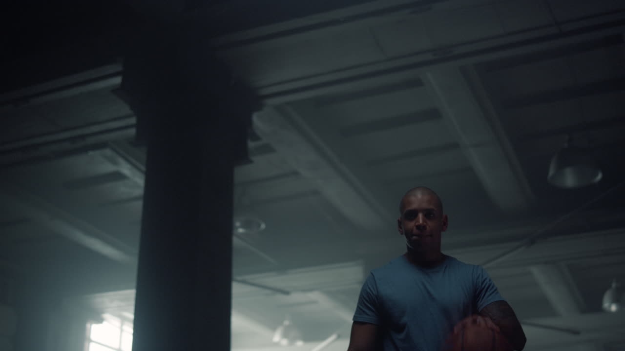 Athlete training with basketball ball. Fitness man bouncing basketball ball