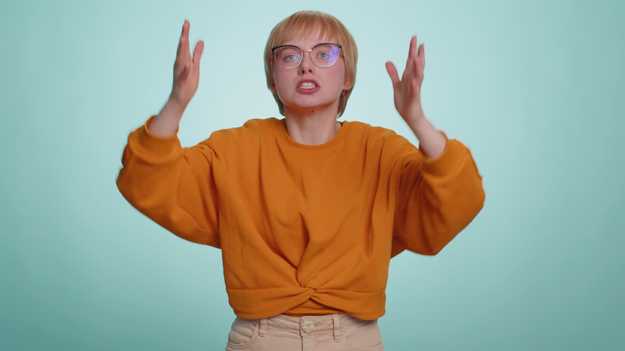 Woman scared fearful covering ears with hands closing eyes meeting her own phobia freaked out